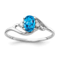 14k White Gold 6x4mm Oval Blue Topaz AA Diamond ring